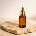 Huile d'argan bio NWAR 50ml - flacon ambre sur pierre naturelle